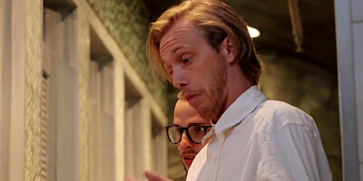 Aroused MILF is choking on a very long cock of her boyfriend in a public bathroom