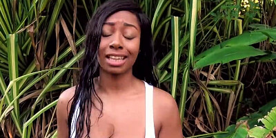 Ebony babe blows white man and gets fucked in the jungle