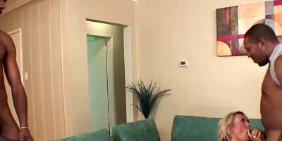 Blond milf enjoys two dicks in a brutal anal interracial threesome