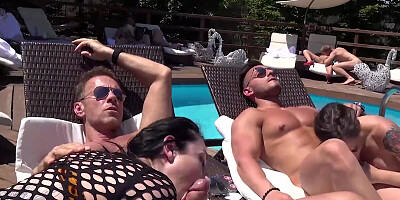 A couple of Italian folks gathered at a pool for an outdoor orgy