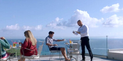 A pair of dazzling babes are having an outdoor threesome on a desolate beach