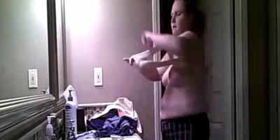 Chubby amateur MILF is being secretly filmed while getting naked