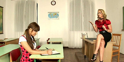 Two naughty chicks are getting fucked in 3some inside the classroom