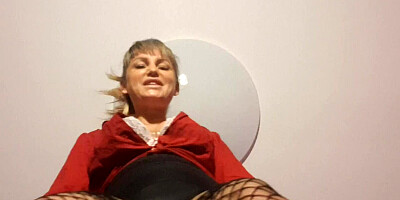 Blonde mistress in sexy stockings and long heels is talking dirty