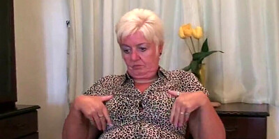 Fat grandma thinks about big black cock while rubbing her cunt