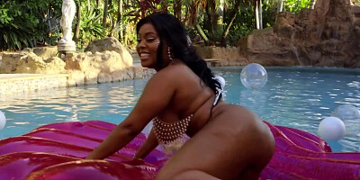 Ebony possessor of massive boobs and butt fucked by the pool