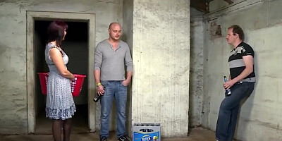 Redhead MILF is double-dicked by two studs in the basement