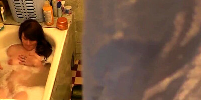 Chubby woman gets horny under the shower and rubs her pussy