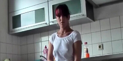 Redhead MILF is fucked and creampied a lot in the kitchen