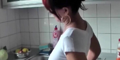 Redhead MILF is fucked and creampied a lot in the kitchen