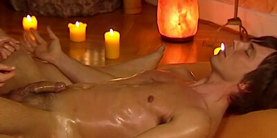 Redhead masseuse massages dude's dick and balls until happy ending