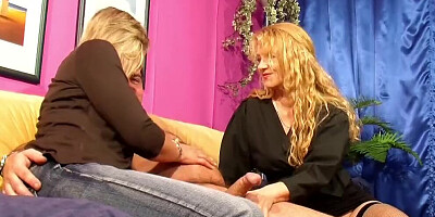 Two naughty blonde cougars are sucking that hard cock together