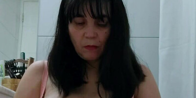 Chubby stepmom is filming herself while rubbing her big nipples