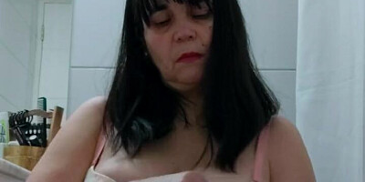 Chubby stepmom is filming herself while rubbing her big nipples