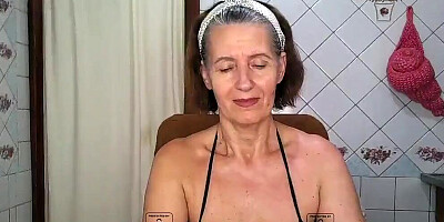 Horny mature woman does strip dance for her fans on live webcam