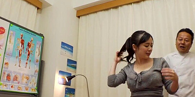 Busty Japanese girl Aimi Yoshikawa is rubbed with oil by a masseur