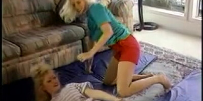 2 blistering blond honeys are cat struggling on carpet