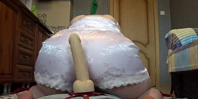 Curvy MILF shows that massive ass and rides a big dildo