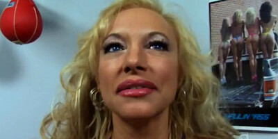 Giant jugs of the blonde cougar are jiggling around while she's viciously pounded