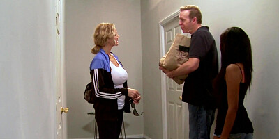 Cock-hungry MILF Julia Ann kneels between two guys and blows them