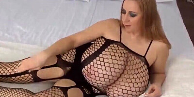 BBW blonde is showing her massive body in black fishnets