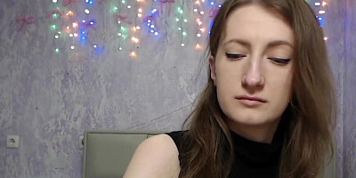 Brunette amateur with naked shoulders on webcam