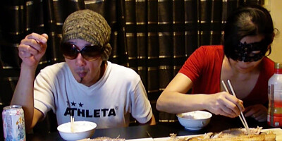 Amateur Asian couple is eating lunch in front of the camera