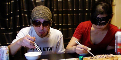 Amateur Asian couple is eating lunch in front of the camera