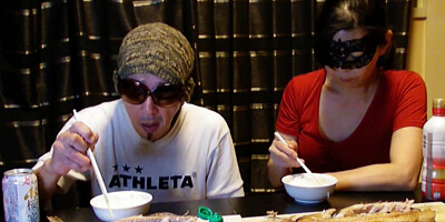 Amateur Asian couple is eating lunch in front of the camera