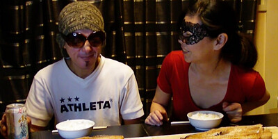 Amateur Asian couple is eating lunch in front of the camera