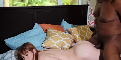 Pale ginger babe takes one of the biggest black dongs in her mouth and pussy