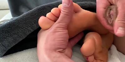 Kinky man is pushing his cock between MILF's lovely feet