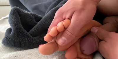 Kinky man is pushing his cock between MILF's lovely feet