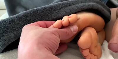 Kinky man is pushing his cock between MILF's lovely feet