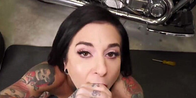 Inked harlot is sucking off and banging a biker in his shop