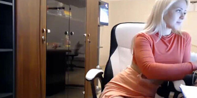 Webcam blonde is taking a break from work to masturbate and finger her cunny