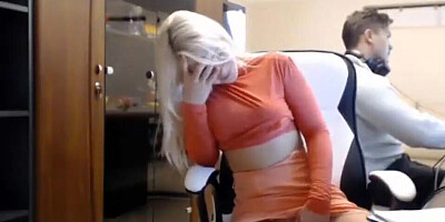 Webcam blonde is taking a break from work to masturbate and finger her cunny