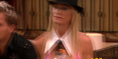 Blonde wife is masturbating in front of a horny group of swingers.