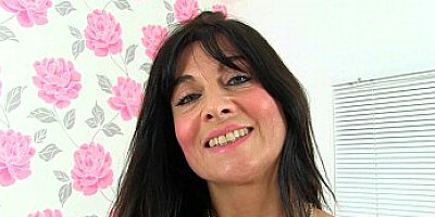 British milf Sam works her clit with a huge vibrator