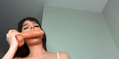 Busty blonde babe is playing with a big suction cup dildo