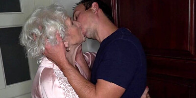 Slutty grandma and a horny guy are having sex in the bedroom