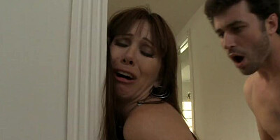 James Deen is banging a superb cougar Rayveness in the kitchen