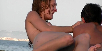 Naked hot babes enjoying a sunny day at the beach