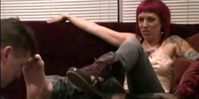 This kinky dude is worshipping redhead girl's feet and toes