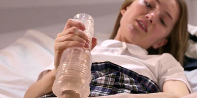 Cute college girl jerks her strapless dick until it squirts