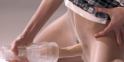 Cute college girl jerks her strapless dick until it squirts