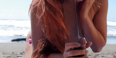Running man finds cute redhead on the beach