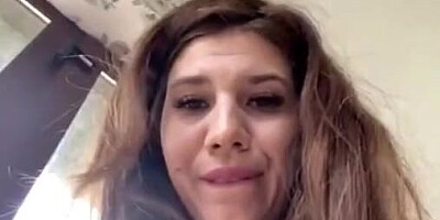 Adorable amateur gal films herself while loosely dressed and teasing