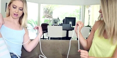 Two young blondes are tied up and banged by a horny guy in a threesome