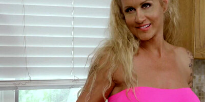 Tattooed blonde MILF is being fucked in a stand-up sex position